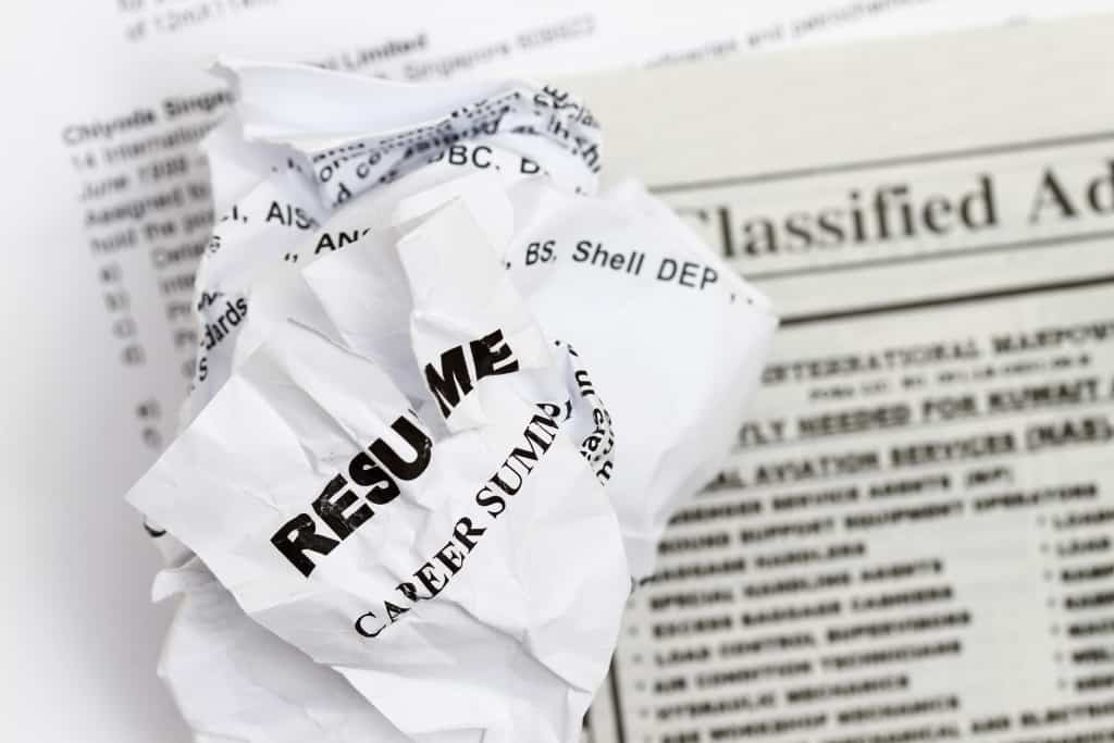 resumes crumpled up and tossed in frustration